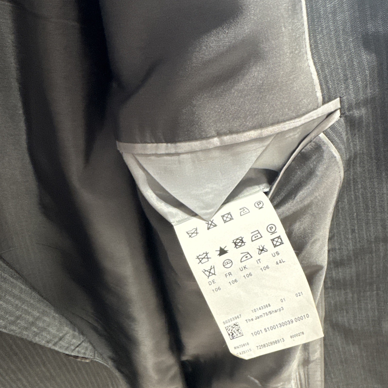 Set of four HUGO BOSS suits/blazers in various sizes/shades of blue and gray.