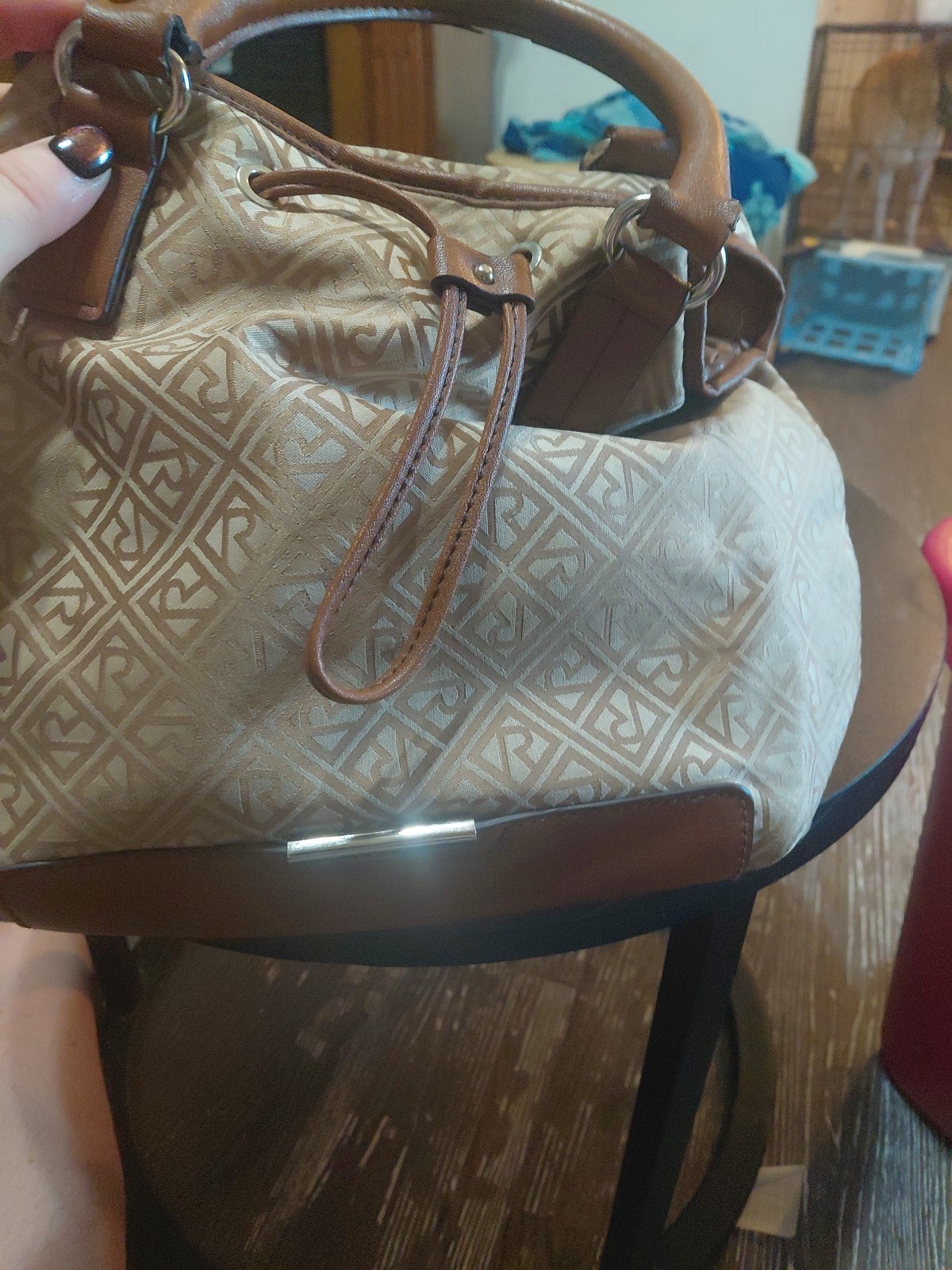 Beige and brown Relic Caraway tote bag With a logo pattern and brown handles.