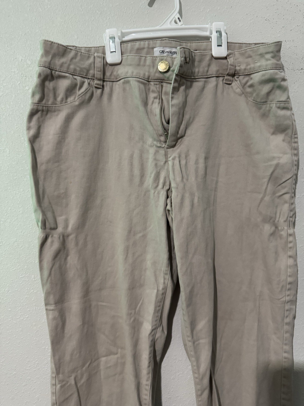 cotton twill chinos, featuring a zipper fly and button closure