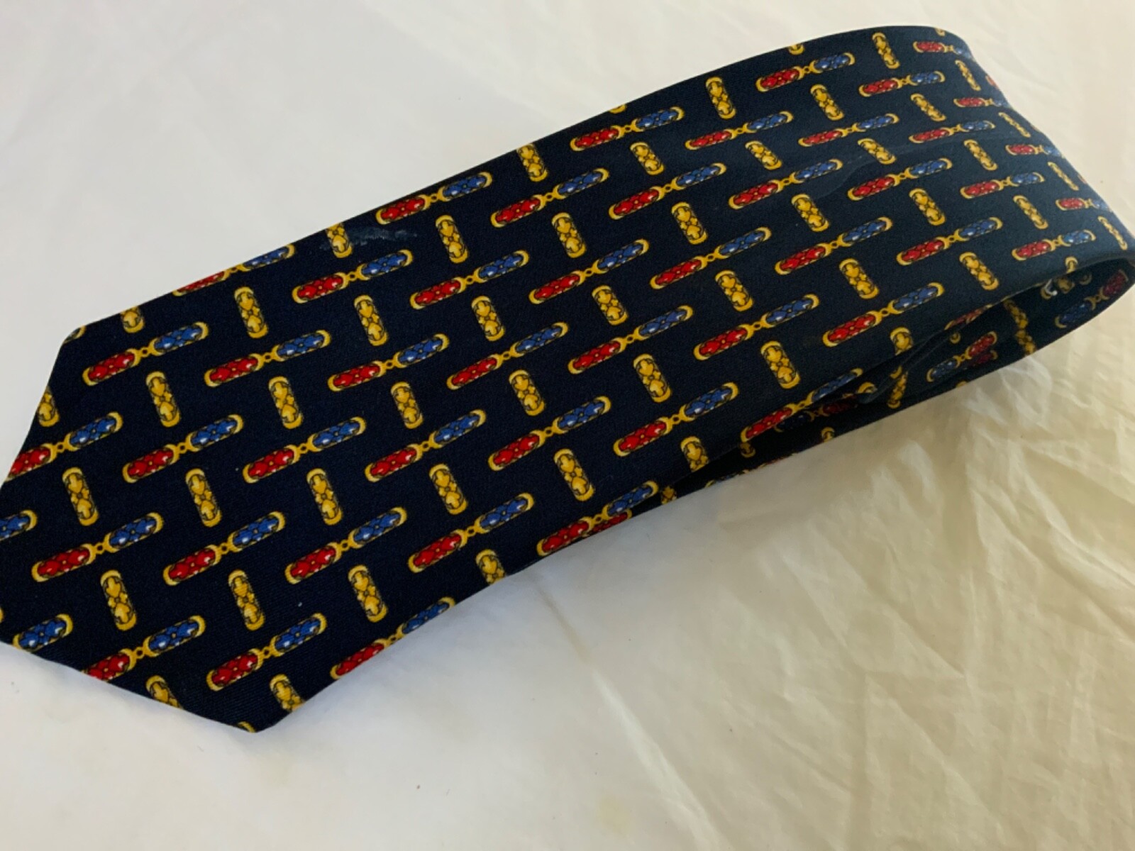 Dickens of London tie United Kingdom navy blue red yellow arrow link pattern