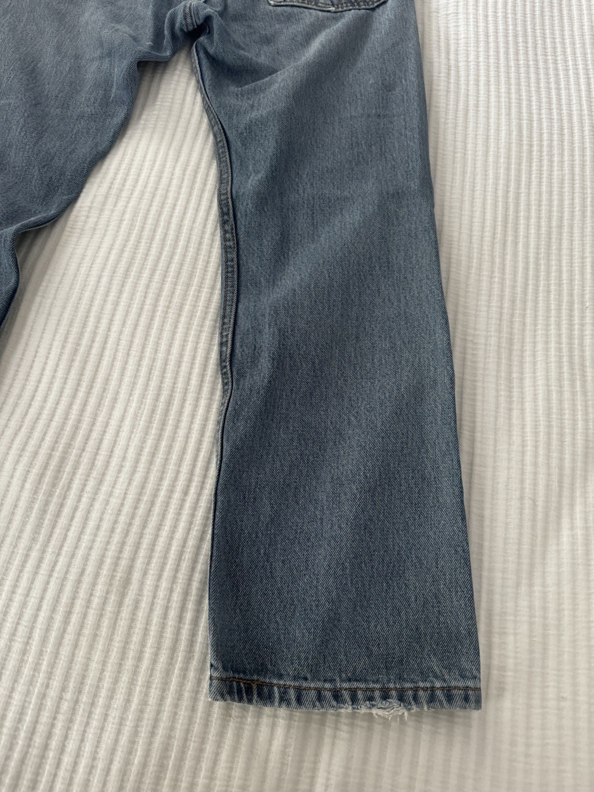 Levi’s 505 thrashed painted and ripped blue jeans 32 X 29