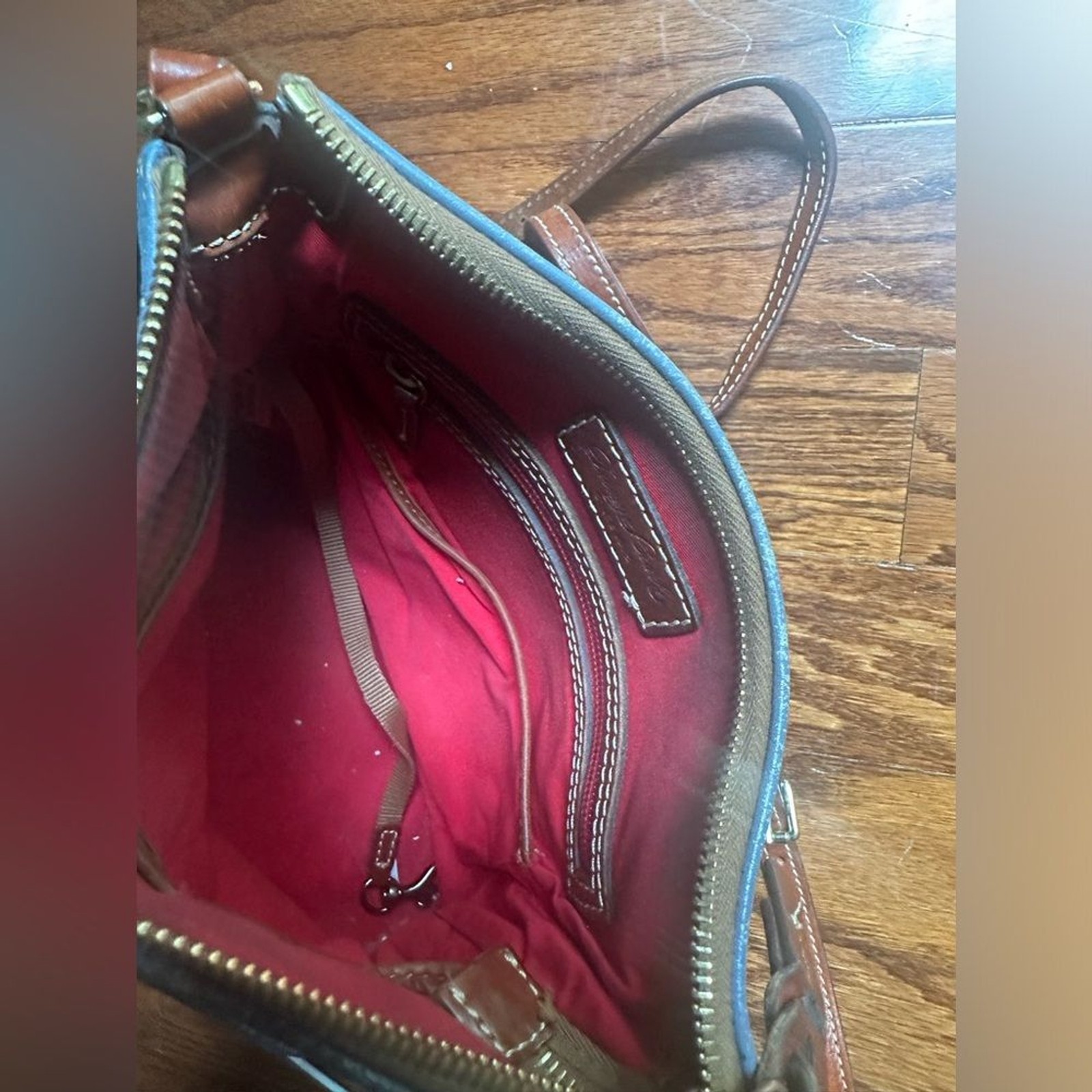 Dooney & Bourke crossbody bag leather in a shade of blue and brown leather trim