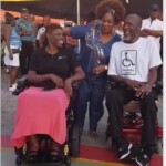 Allyson chatting with members of the Barbados Council for the Disabled at Q in the Community.