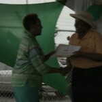 Dr. Allyson Leacock making a presentation to representatives of the Barbados Special Olympics Team